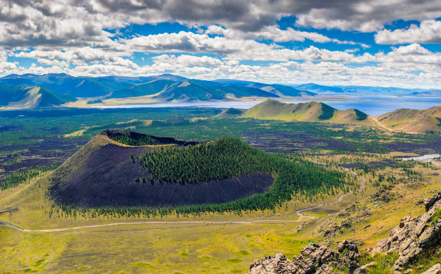 Khorgo crater with forest and Terkhiin Tsagaan Lake beyond.